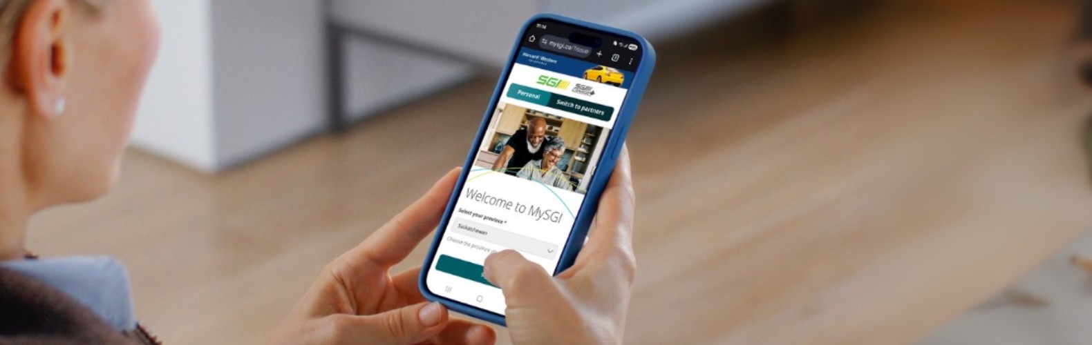 women holding mobile phone in kitchen with MYSGI on the screen